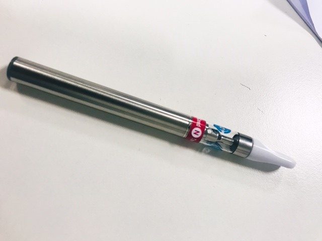 GROW: A silver vape pen on a white surface