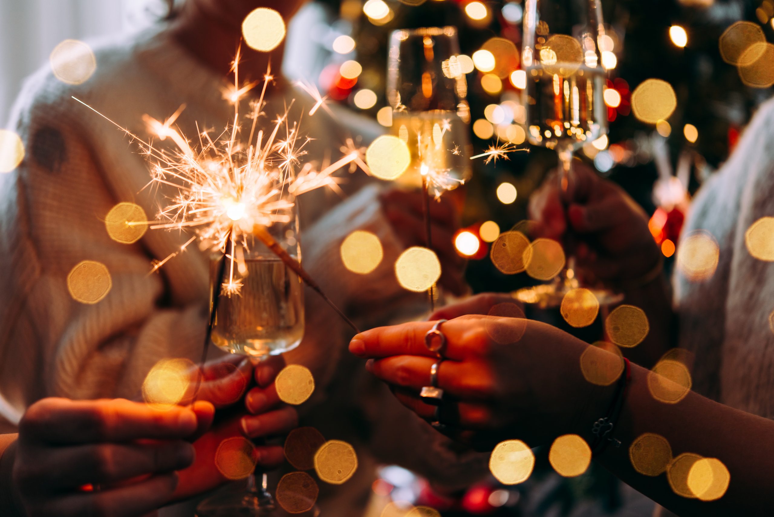 Christmas: A row of champagne flutes and sparkles 